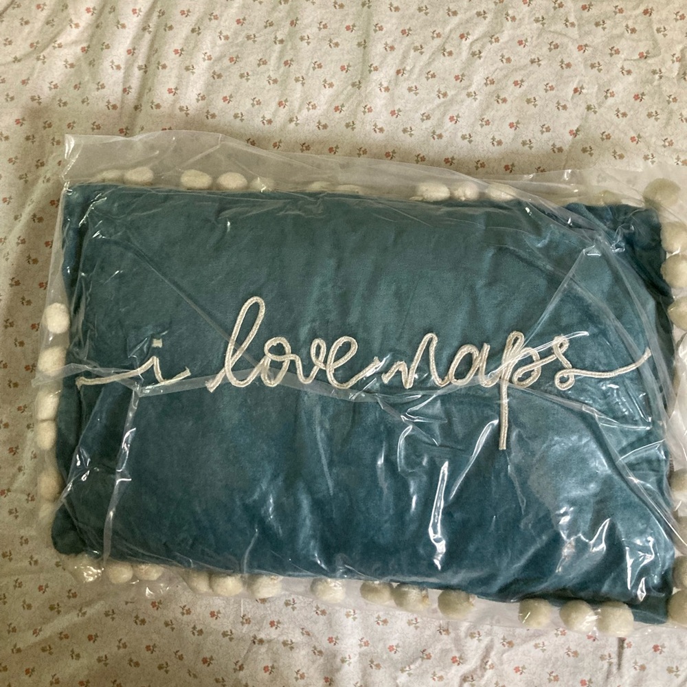 i love naps pom pom detail pillow. still in packaging